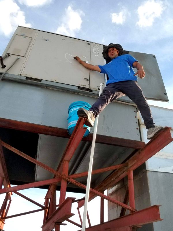 Only HVAC LLC technician rigging a rooftop unit